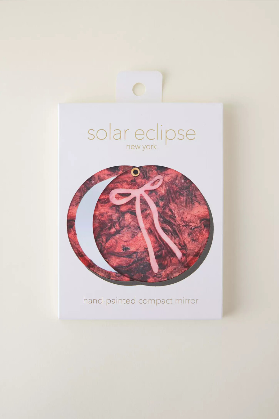 pettine con fiocco rosso eclissi solare